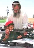 Settler showing kid gun.jpg (7022 bytes)